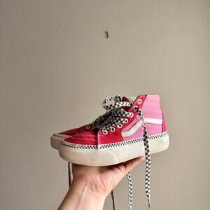 Pink and red high top Vans